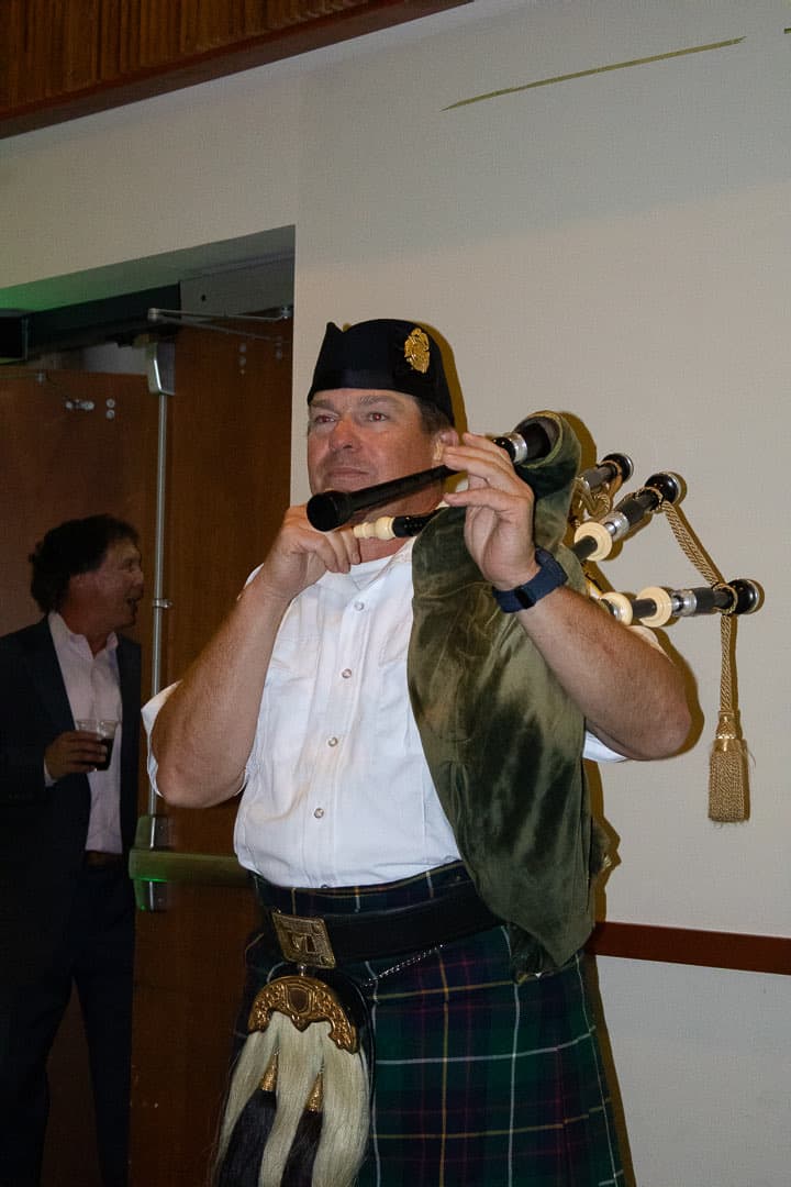 The piper leads the room in