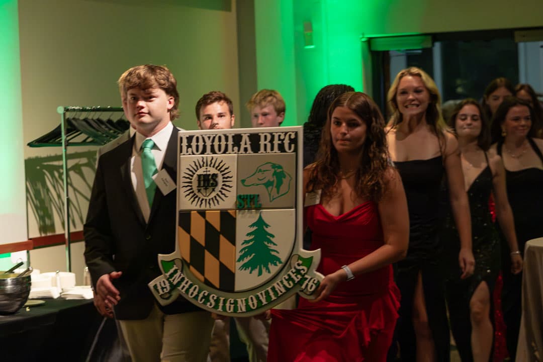The procession past the club crest