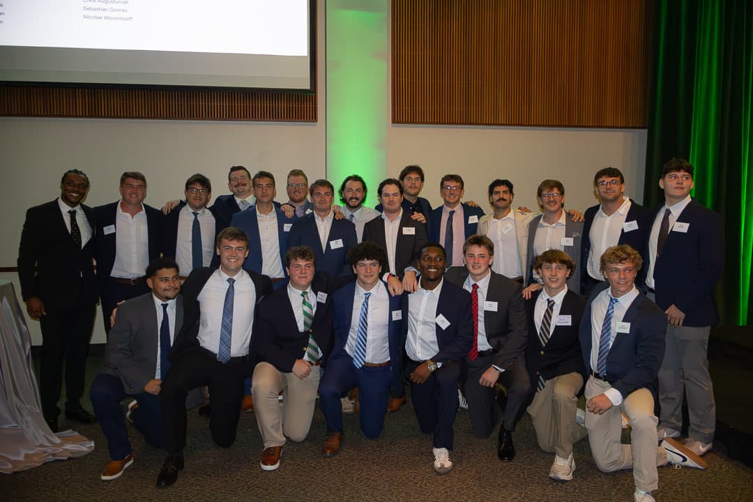 The 2026 scholarship awardees together on stage at McGuire Hall