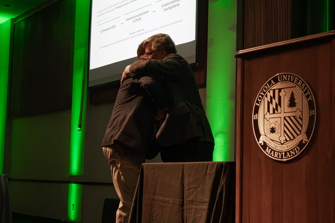An embrace at the podium