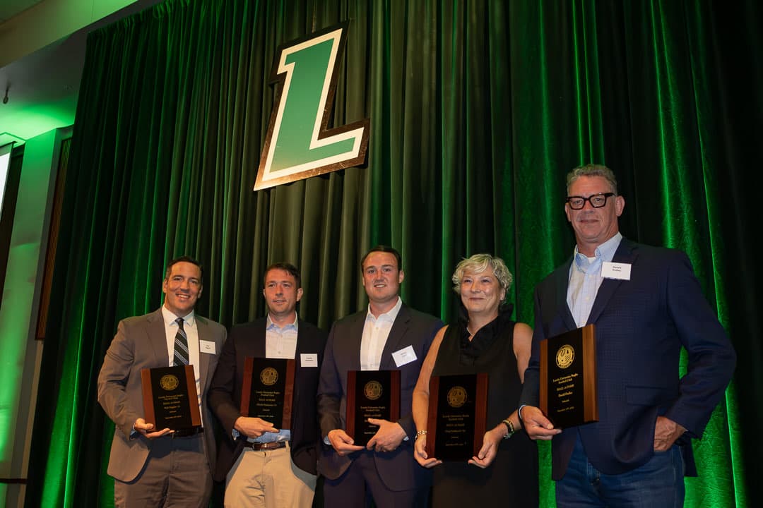 The Hall of Fame Class of 2026 with their plaques