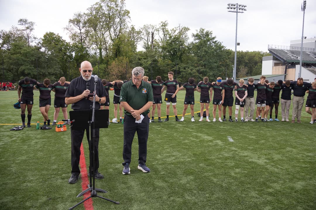 Heads bowed on the pitch