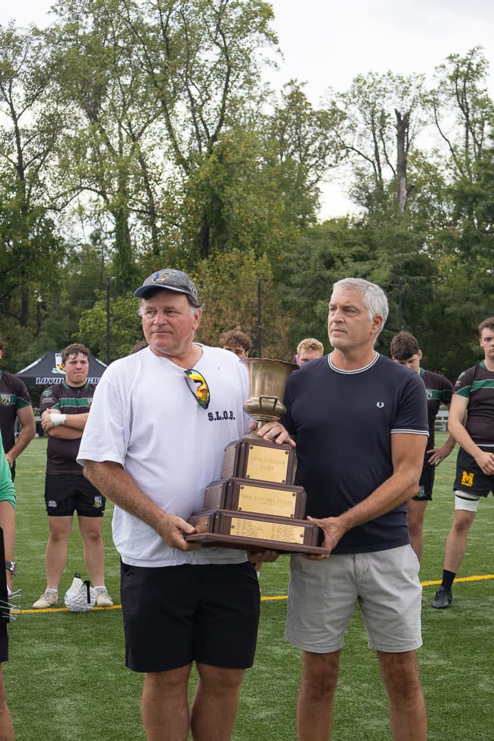 Holding the trophy that carries his name