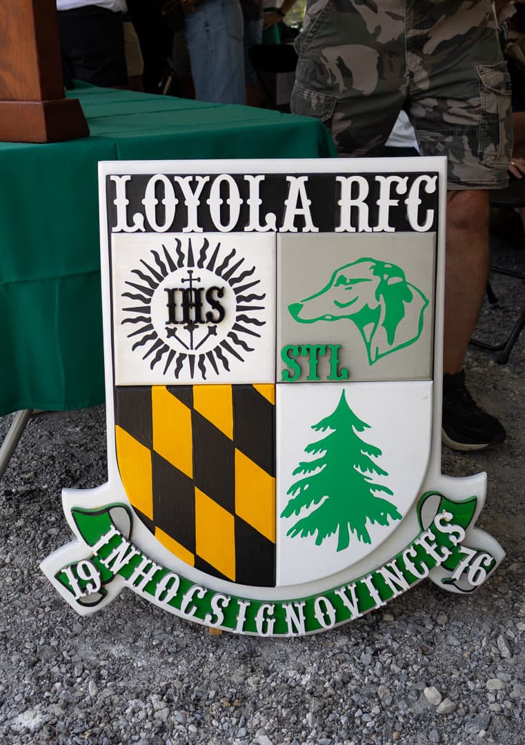The Loyola RFC crest beside the tent