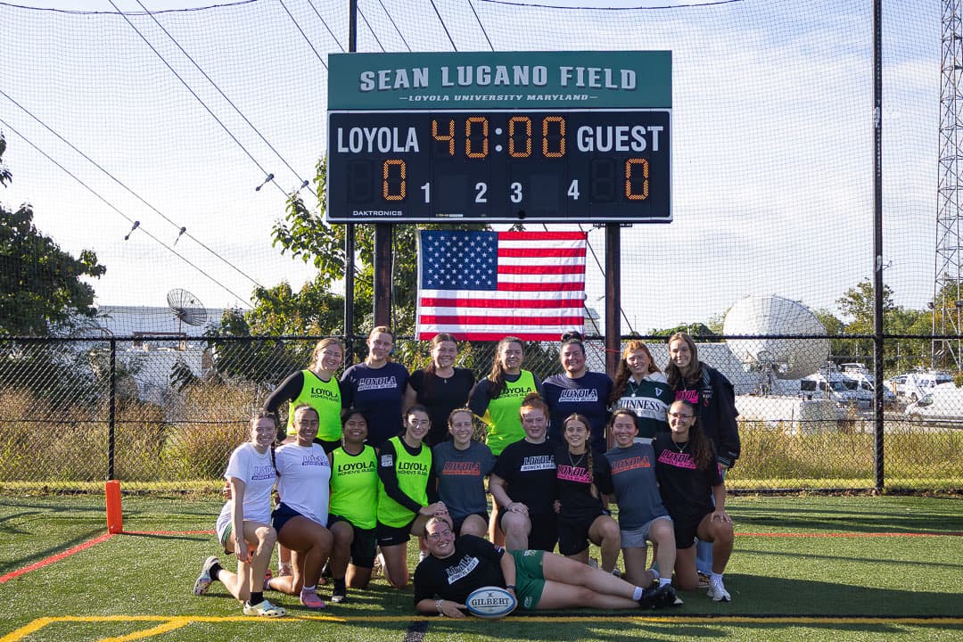 Both women's squads posed under the Sean Lugano Field scoreboard before kickoff