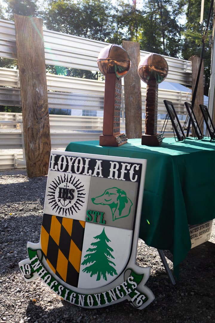 The Loyola RFC crest propped beside the trophy table