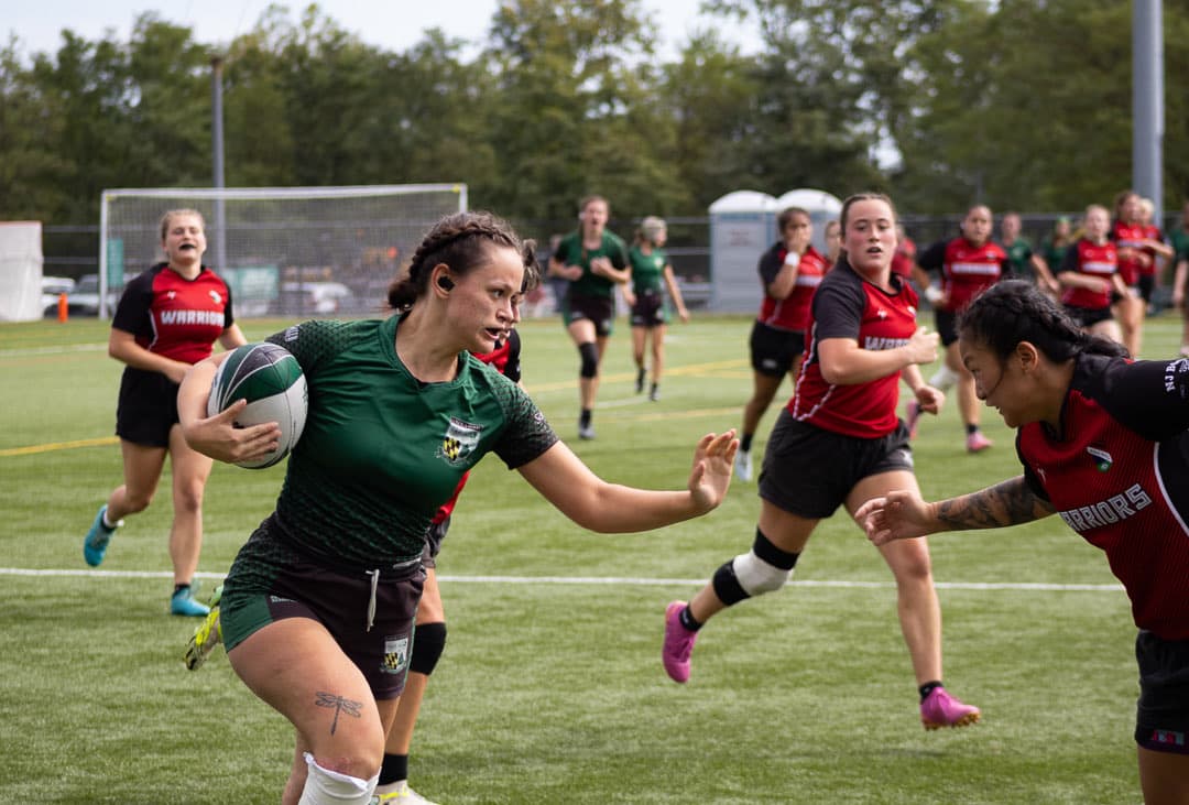 Fending off a tackler on the run